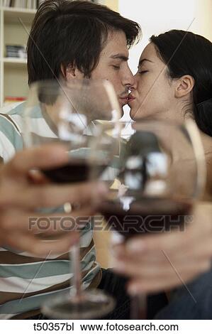 Couple toasting with red wine View Large Photo Image Stock Image - Couple toasting with red wine. Fotosearch
