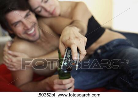 Couple watching TV View Large Photo Image Stock Image - Couple watching TV. Fotosearch