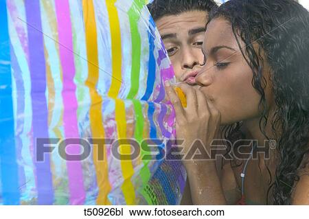 Couple, woman inflating ball View Large Photo Image Stock Image - Couple, woman inflating ball. Fotosearch