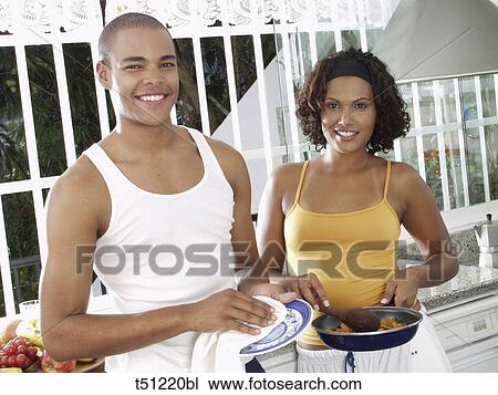 Couple's portrait in the kitchen View Large Photo Image Stock Image - Couple's portrait in the kitchen. Fotosearch