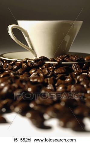 Cup and coffee beans View Large Photo Image Stock Image - Cup and coffee beans. Fotosearch