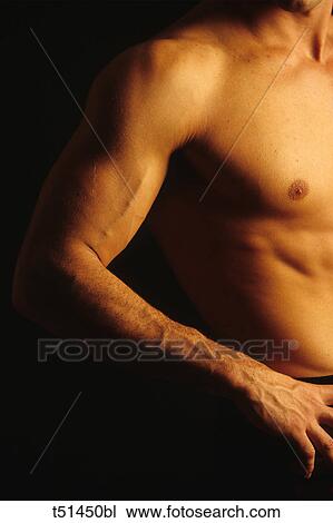 Stock Image - Detail of a man arm and torso. Fotosearch