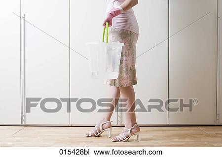 detail of young woman ready to do housecleaning View Large Photo Image Stock Image - detail of young woman ready to do housecleaning. Fotosearch