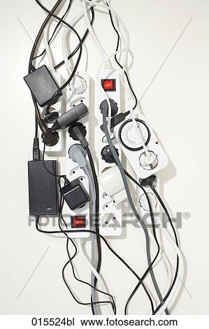 Stock Image - disorder of different cables and sockets. Fotosearch