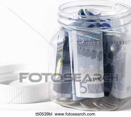Euro coins and banknotes in jar View Large Photo Image Stock Image - Euro coins and banknotes in jar. Fotosearch