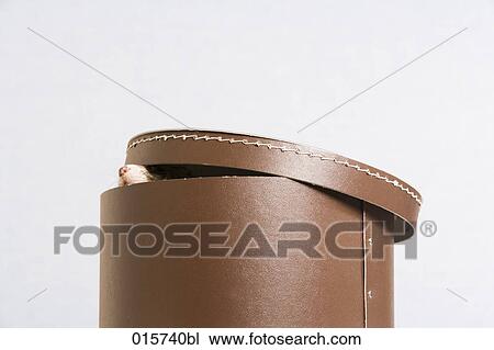 Stock Image - ferret peeking out of hat box. Fotosearch