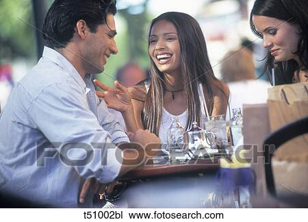 Stock Image - Friends at cafe. Fotosearch