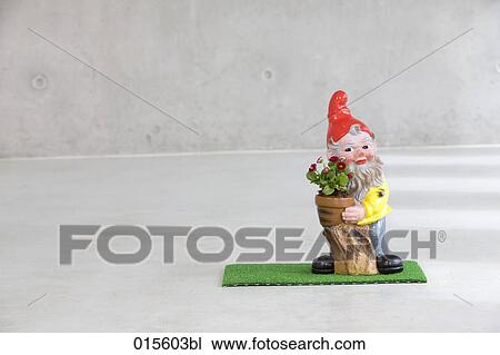 garden gnome holding potted flower View Large Photo Image Stock Image - garden gnome holding potted flower. Fotosearch
