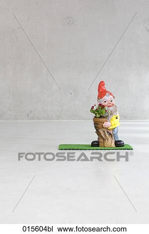 garden gnome holding potted flower View Large Photo Image Stock Image - garden gnome holding potted flower. Fotosearch