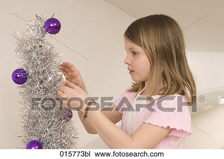 girl decorating christmas tree View Large Photo Image Stock Image - girl decorating christmas tree. Fotosearch