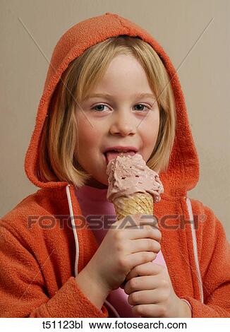 Stock Image - Girl eating ice cream. Fotosearch