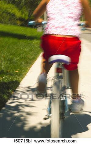 Girl on bicycle View Large Photo Image Stock Image - Girl on bicycle. Fotosearch