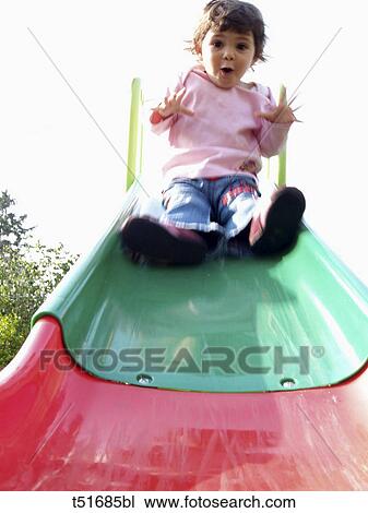Girl on slide View Large Photo Image Stock Image - Girl on slide. Fotosearch