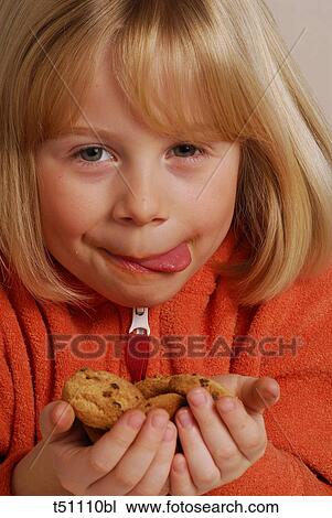 Girl with biscuits View Large Photo Image Stock Image - Girl with biscuits. Fotosearch