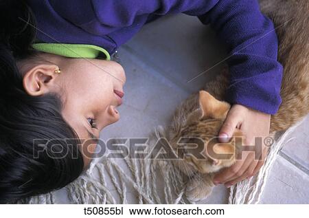 Girl with red european cat View Large Photo Image Stock Image - Girl with red european cat. Fotosearch