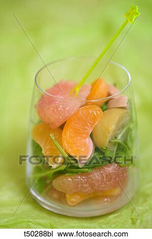 Glass of fresh citrus fruits, lemon and rocket salad with a calamondin juice View Large Photo Image Stock Image - Glass of fresh citrus fruits, lemon and rocket salad with a calamondin juice. Fotosearch