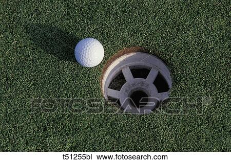 Golf ball and hole View Large Photo Image Stock Image - Golf ball and hole. Fotosearch