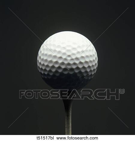 Golf ball on tee View Large Photo Image Stock Image - Golf ball on tee. Fotosearch
