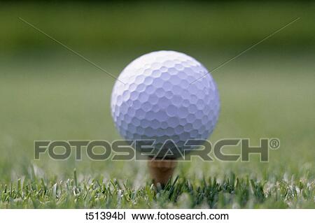Golf ball sitting on a tee View Large Photo Image Stock Image - Golf ball sitting on a tee. Fotosearch