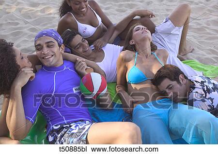 Group of friends on the beach View Large Photo Image Stock Image - Group of friends on the beach. Fotosearch