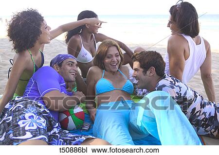 Group of friends on the beach View Large Photo Image Stock Image - Group of friends on the beach. Fotosearch