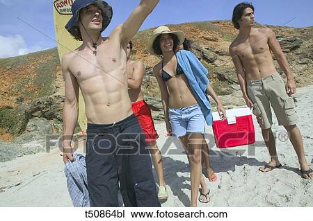 Stock Image - Group of young people on the beach. Fotosearch