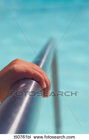 Hand on pool handrail View Large Photo Image Stock Image - Hand on pool handrail. Fotosearch