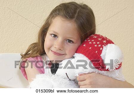headshot of little girl holding cuddly toy in shape of polar bear View Large Photo Image Stock Image - headshot of little girl holding cuddly toy in shape of polar bear. Fotosearch