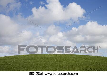 Stock Image - Hill and clouds. Fotosearch