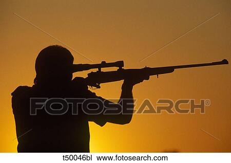 Hunter at sunset View Large Photo Image Stock Image - Hunter at sunset. Fotosearch