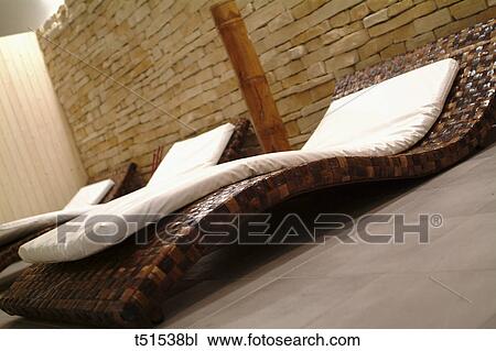 Stock Image - Interior of spa, wicker beds. Fotosearch
