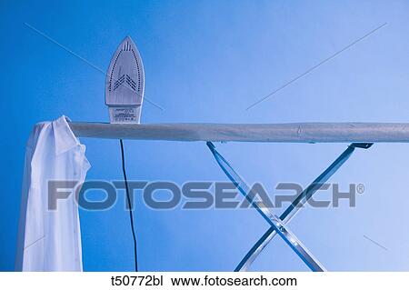 Stock Image - Iron board and iron. Fotosearch