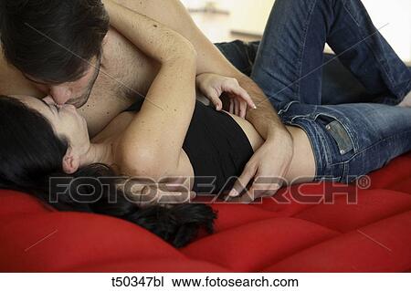 Kissing couple lying on on airbed View Large Photo Image Stock Image - Kissing couple lying on on airbed. Fotosearch