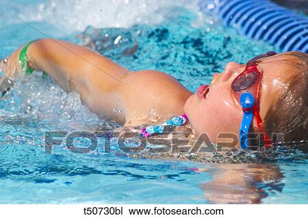 Little girl in swimming pool View Large Photo Image Stock Image - Little girl in swimming pool. Fotosearch