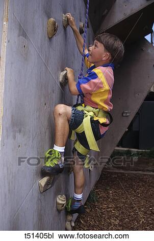 Male child wallclimbing indoors View Large Photo Image Stock Image - Male child wallclimbing indoors. Fotosearch