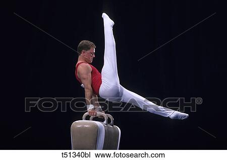 Male gymnast performing on the pomell horse View Large Photo Image Stock Image - Male gymnast performing on the pomell horse. Fotosearch