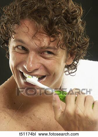 Man brushing teeth View Large Photo Image Stock Image - Man brushing teeth. Fotosearch