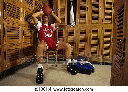 Man in a locker room with basketball View Large Photo Image Stock Image - Man in a locker room with basketball. Fotosearch