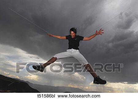 Man jumping outdoors View Large Photo Image Stock Image - Man jumping outdoors. Fotosearch