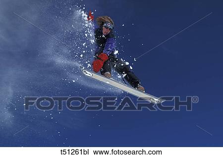 Man jumping with snowboard View Large Photo Image Stock Image - Man jumping with snowboard. Fotosearch