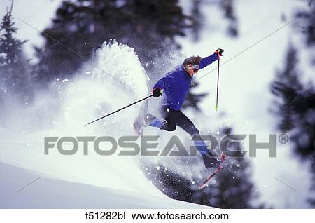 Man jumping with snowshoes View Large Photo Image Stock Image - Man jumping with snowshoes. Fotosearch