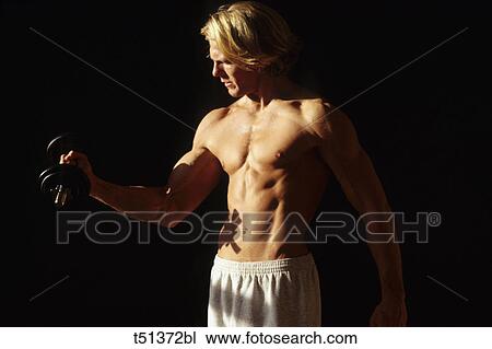 Man Max exercising with dumbbell View Large Photo Image Stock Image - Man Max exercising with dumbbell. Fotosearch