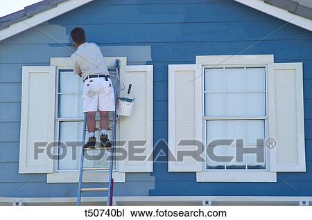 Man painting house facade View Large Photo Image Stock Image - Man painting house facade. Fotosearch