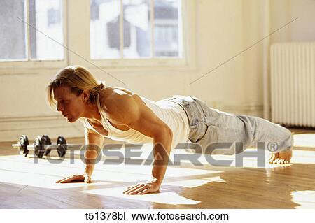 Man performing pushups in gym View Large Photo Image Stock Image - Man performing pushups in gym. Fotosearch