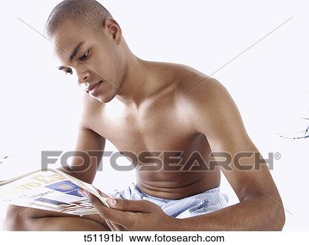 Man reading a magazine View Large Photo Image Stock Image - Man reading a magazine. Fotosearch