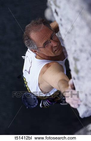 Man rock climbing View Large Photo Image Stock Image - Man rock climbing. Fotosearch