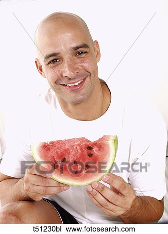 Man with a slice of watermelon View Large Photo Image Stock Image - Man with a slice of watermelon. Fotosearch