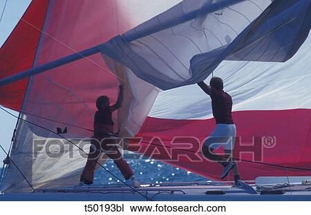 Men on sailboat View Large Photo Image Stock Image - Men on sailboat. Fotosearch