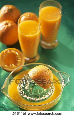 Orange juices and squeezer View Large Photo Image Stock Image - Orange juices and squeezer. Fotosearch