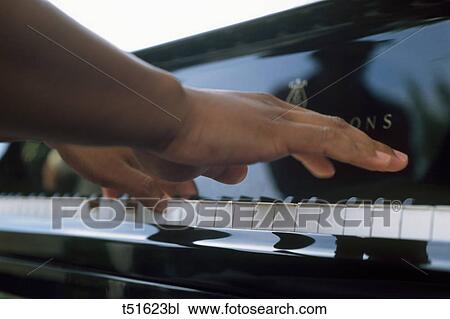 Piano playing View Large Photo Image Stock Image - Piano playing. Fotosearch